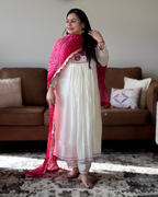 Dhwani wearing premium mul chanderi white anarkali suit with red bandhani dupatta – Go Desi Canada