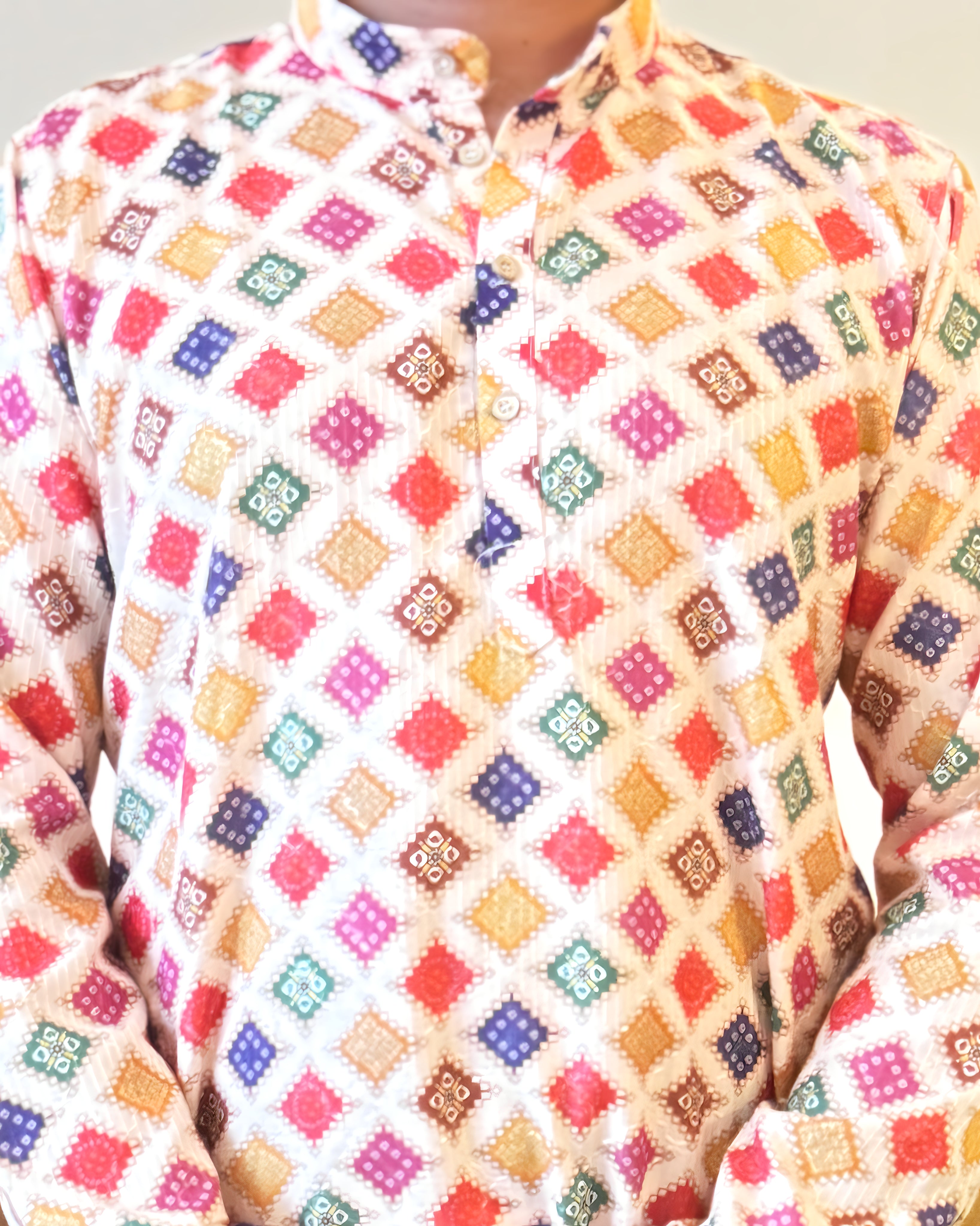 Colorful patterned shirt with a diamond grid design on a white background
