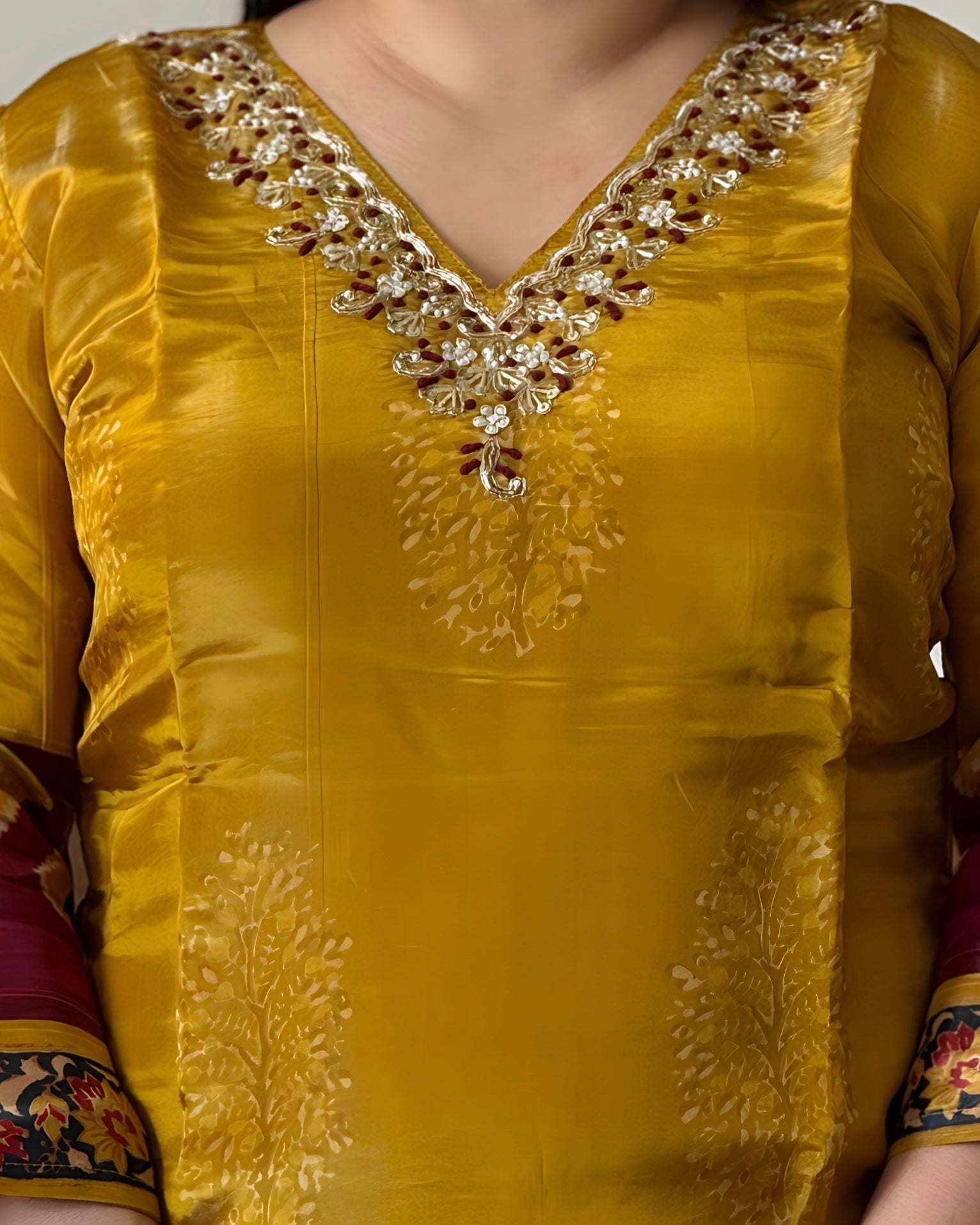 Yellow traditional outfit with intricate embroidery