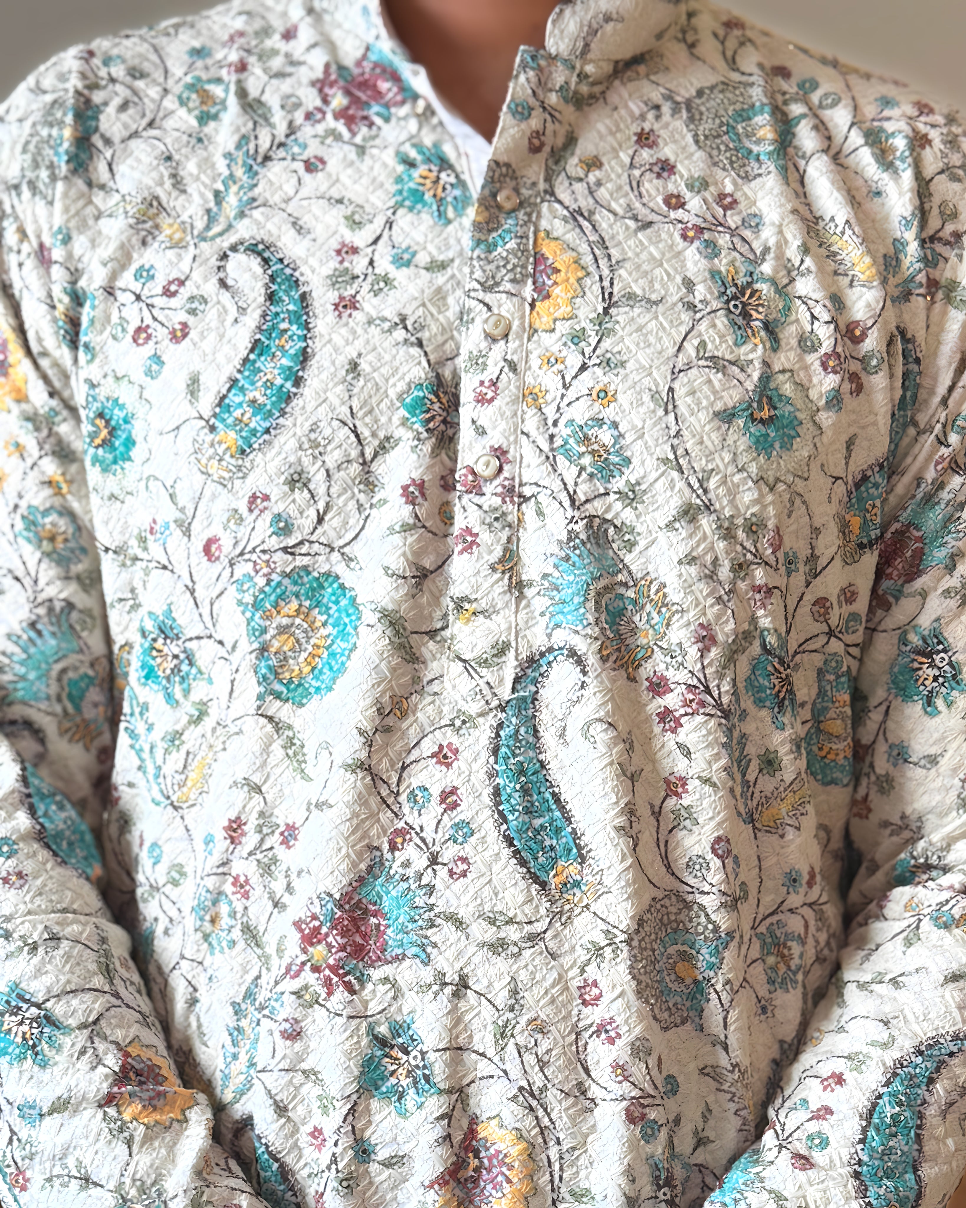 Close-up of a floral patterned fabric with intricate designs.