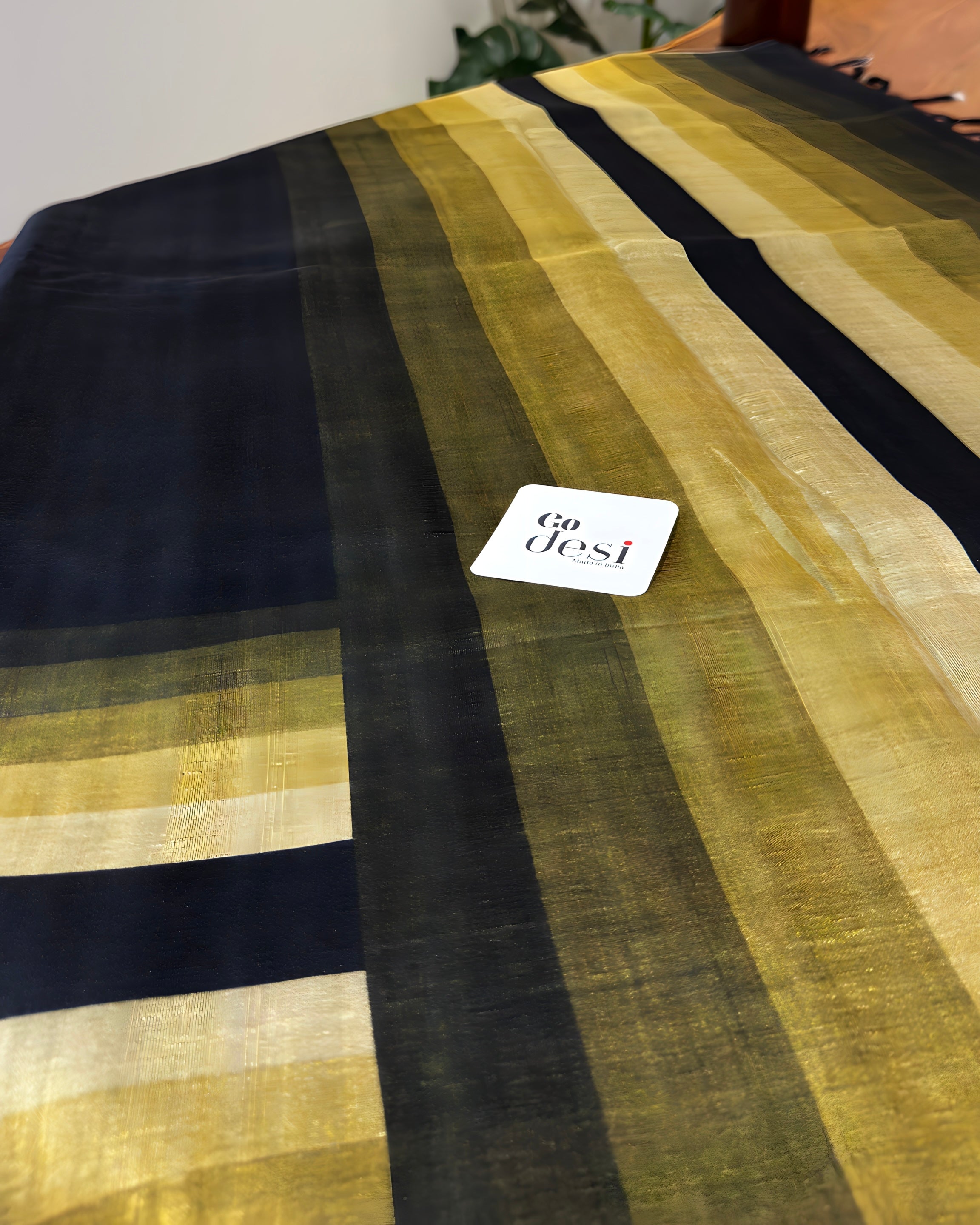 Striped fabric with black and yellow pattern on a white background