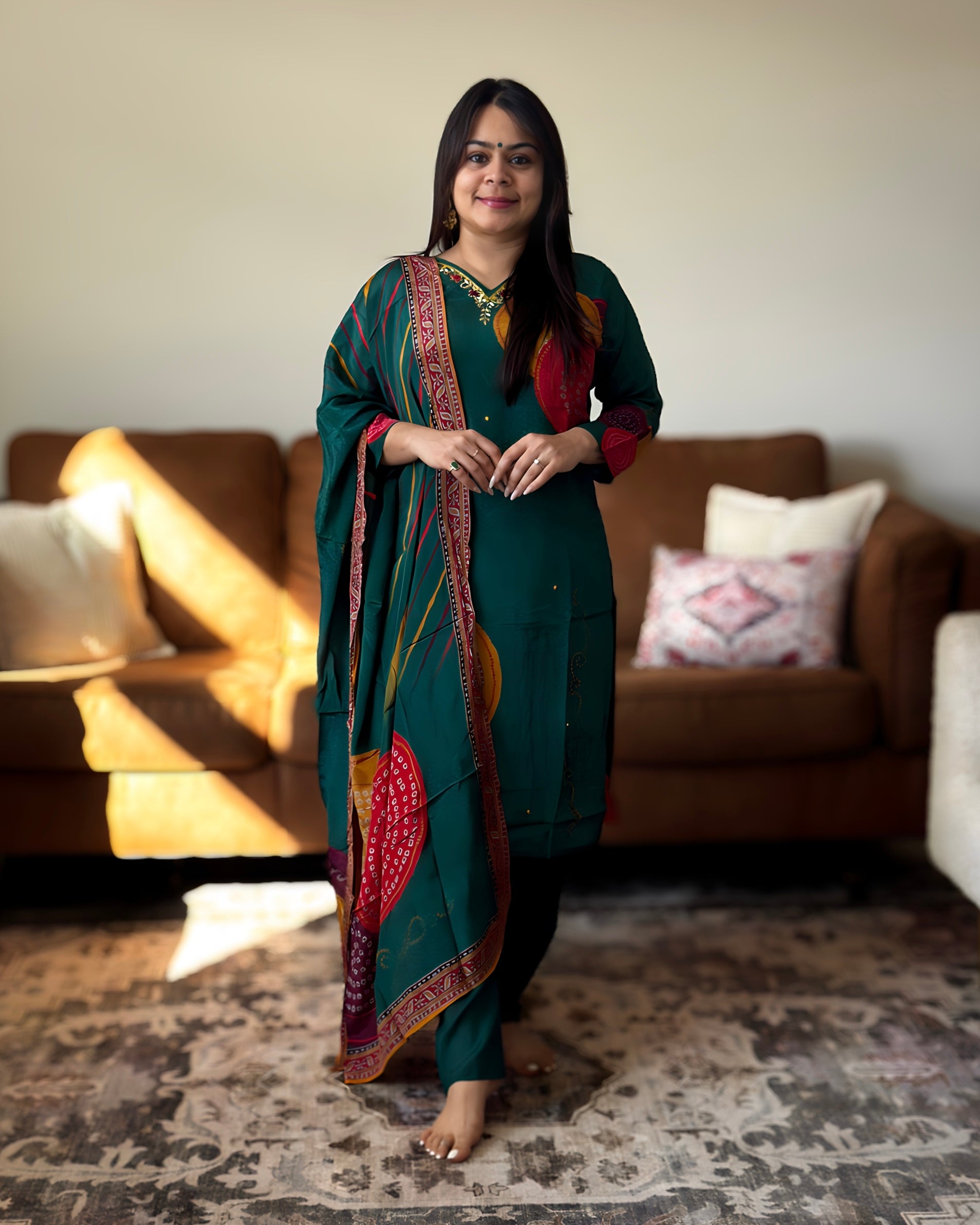 Woman in a traditional outfit standing in a living room.