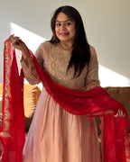 Dhwani wearing premium silk peach anarkali suit with red bandhani dupatta – Go Desi Canada