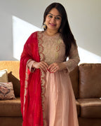 Dhwani wearing premium silk peach anarkali suit with red bandhani dupatta – Go Desi Canada
