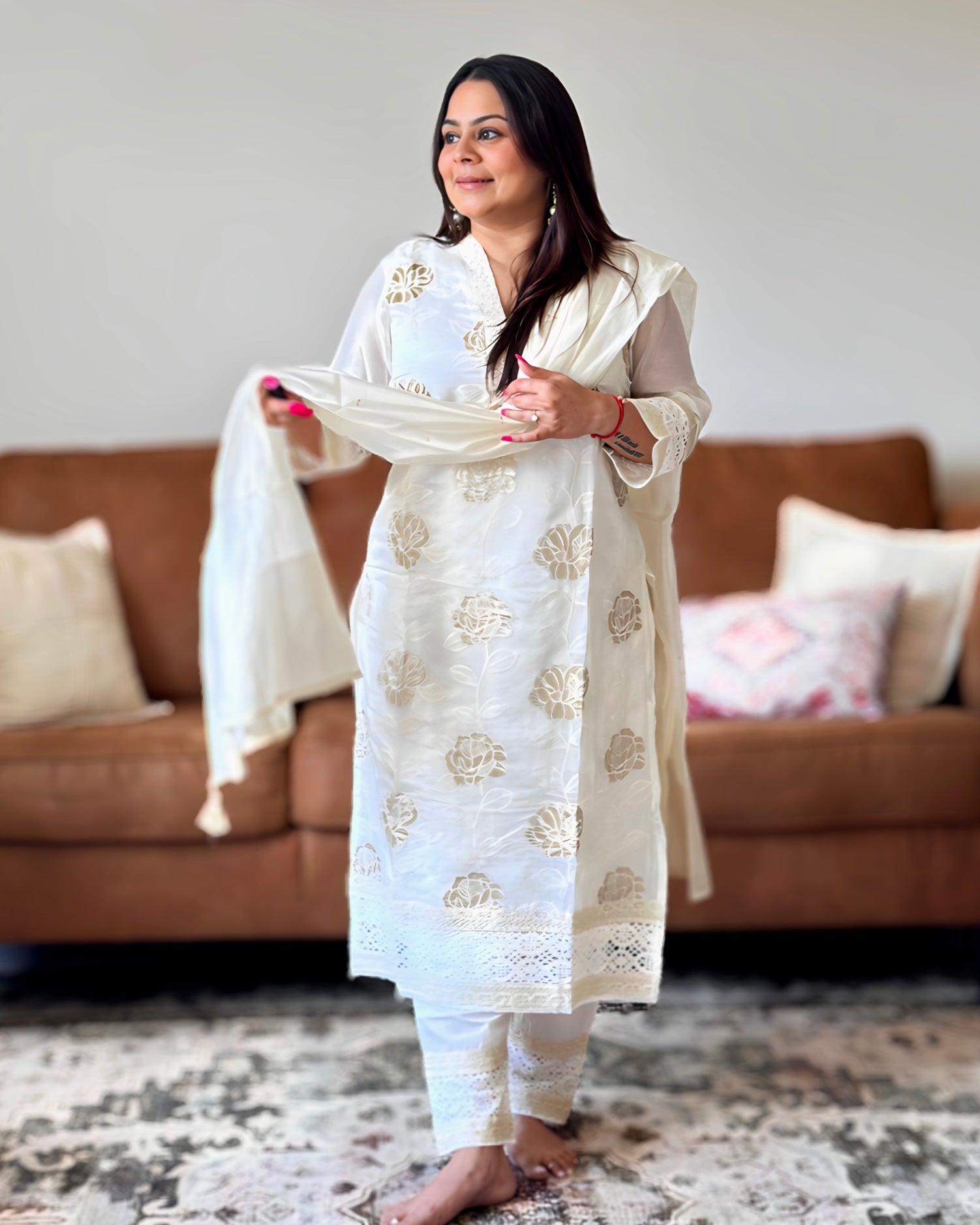 Dhwani wearing ivory glass tissue golden embroidered suit with lace detailing and matching dupatta – Go Desi Canada